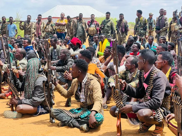 Somali National Armed Forces and Macawisley community defense forces gather near Moqokori town in Hiiraan